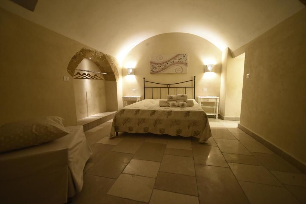 Łóżko lub łóżka w pokoju w obiekcie B&B Corte Cantalupi