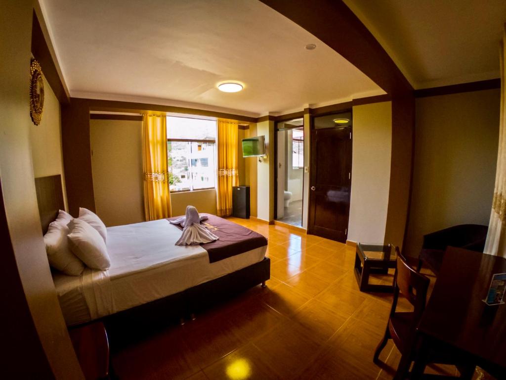 Postel nebo postele na pokoji v ubytování Gran Hotel Panorama