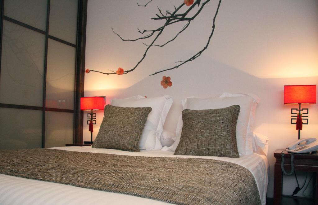 Кровать или кровати в номере Le Petit Boutique Hotel