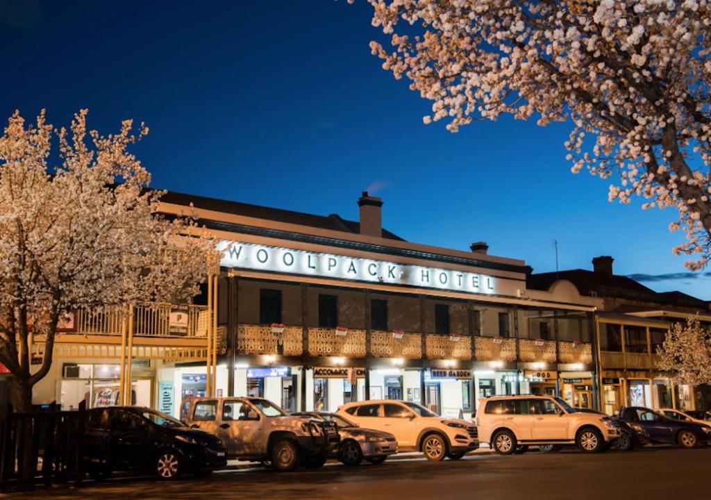 cars parked in front of a store at The Woolpack Hotel in Mudgee
