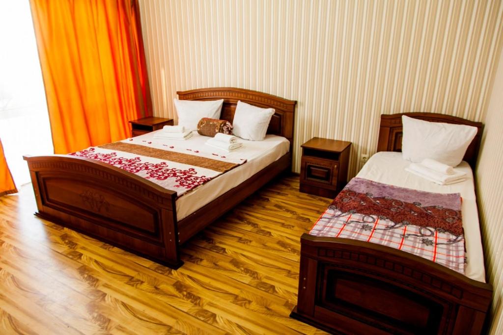 Cama o camas de una habitación en Отель Райский Уголок в Абхазии