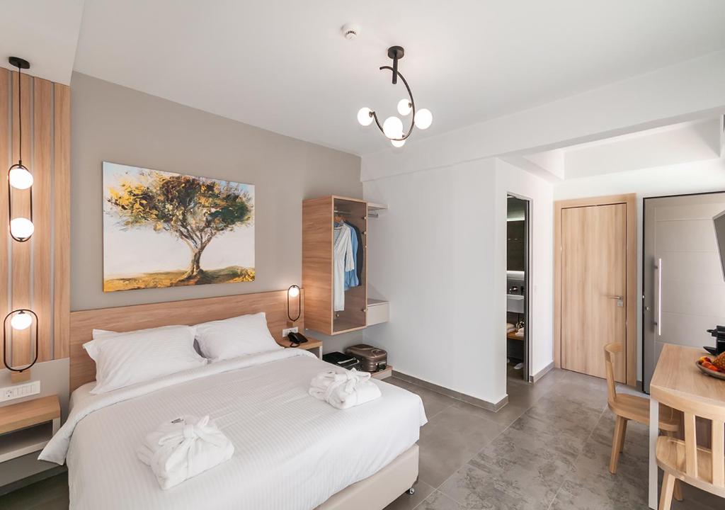 Postel nebo postele na pokoji v ubytování Epavli Boutique Hotel