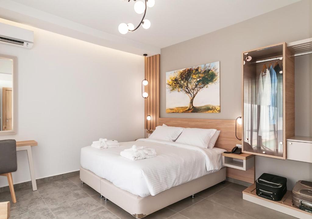 Postel nebo postele na pokoji v ubytování Epavli Boutique Hotel