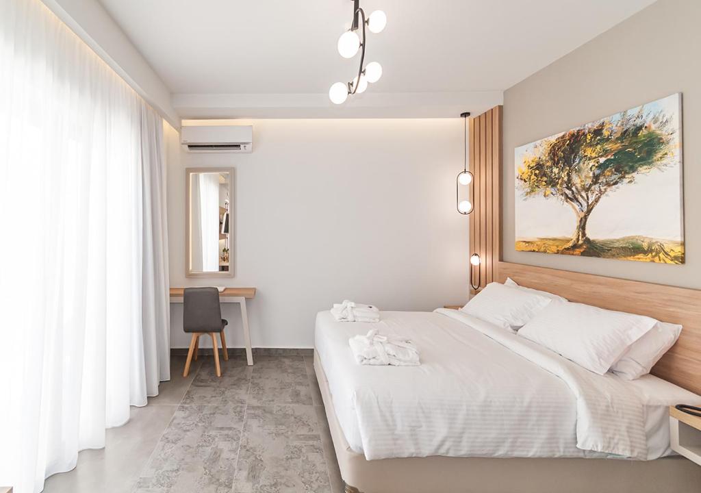 Postel nebo postele na pokoji v ubytování Epavli Boutique Hotel