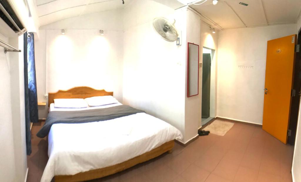 Postel nebo postele na pokoji v ubytování Grand Star Hotel