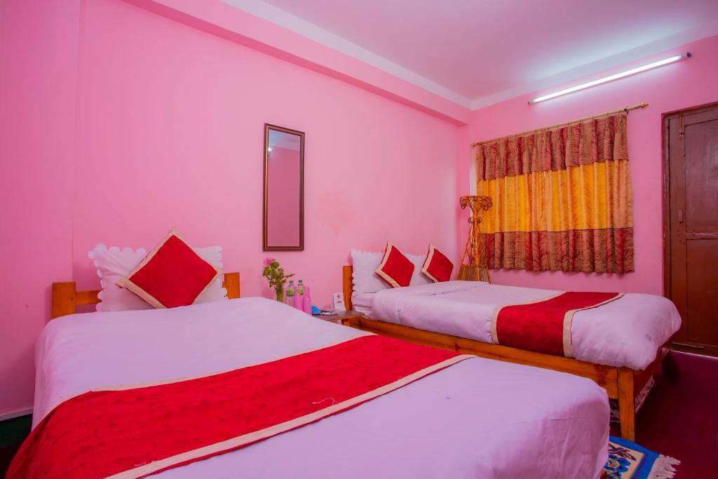 Postel nebo postele na pokoji v ubytování Sunrise Moon Beam Hotel