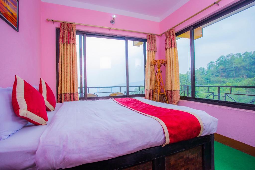 Postel nebo postele na pokoji v ubytování Sunrise Moon Beam Hotel