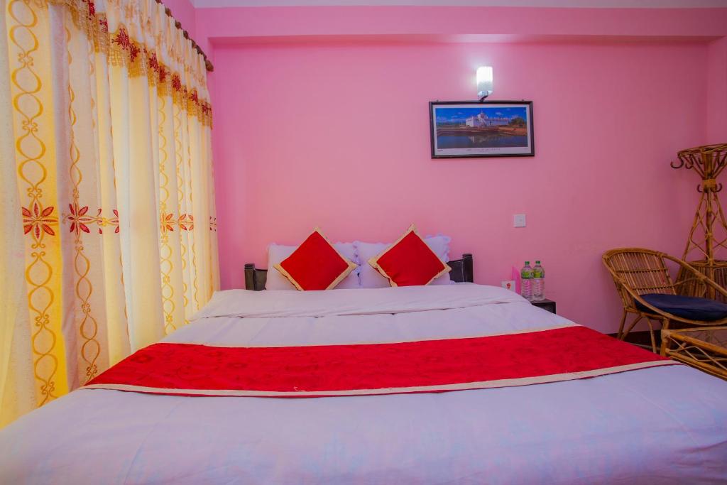 Postel nebo postele na pokoji v ubytování Sunrise Moon Beam Hotel