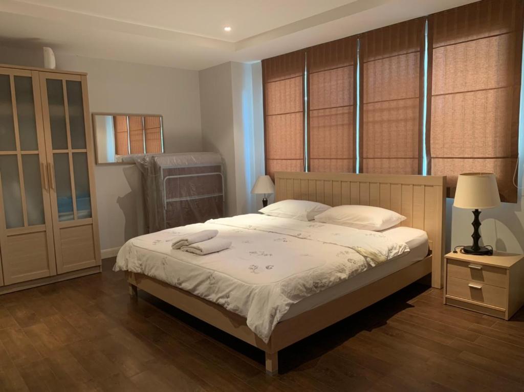 Postel nebo postele na pokoji v ubytování Jomtien Beach Penthouses Condo