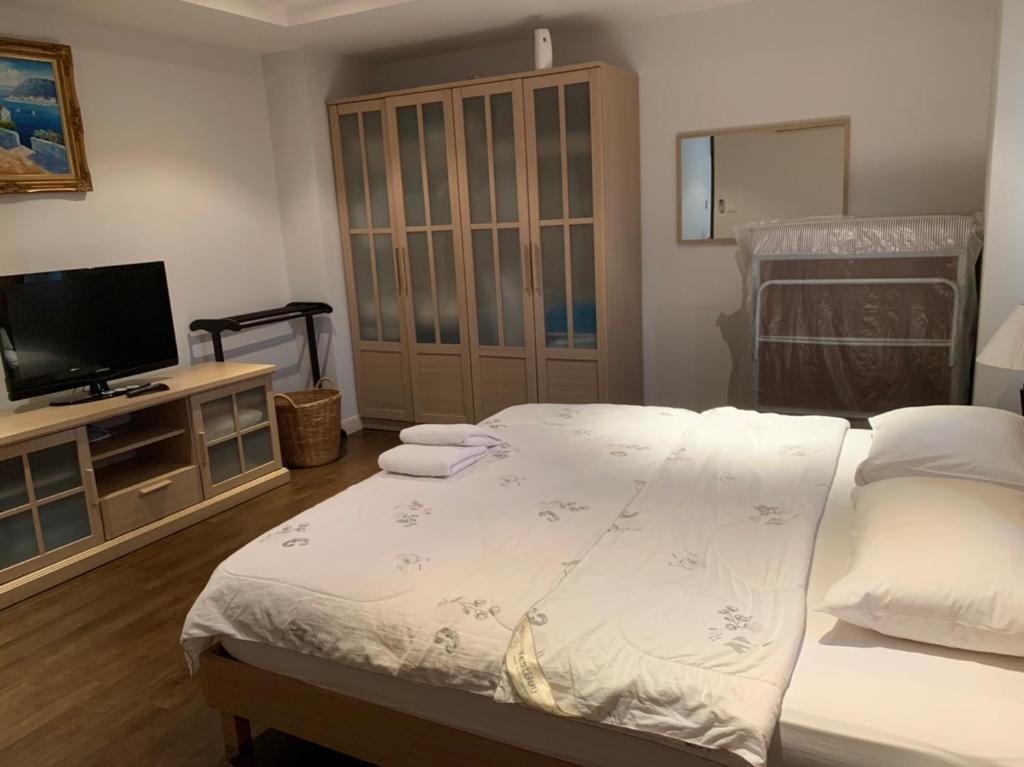 Postel nebo postele na pokoji v ubytování Jomtien Beach Penthouses Condo