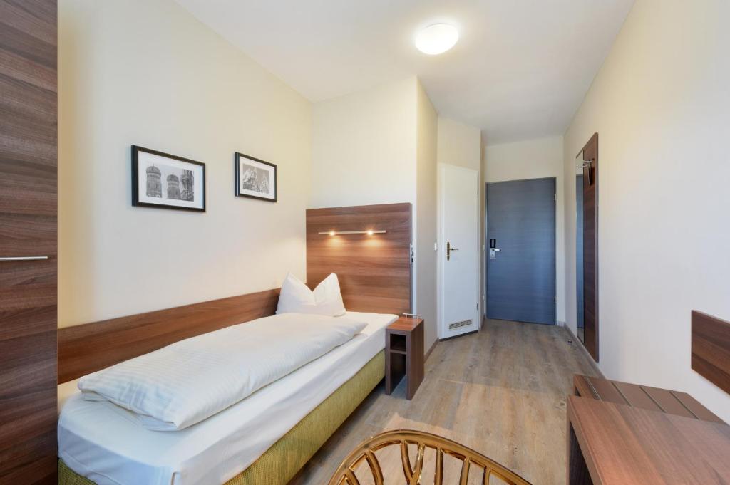Postel nebo postele na pokoji v ubytování Hotel Säntis