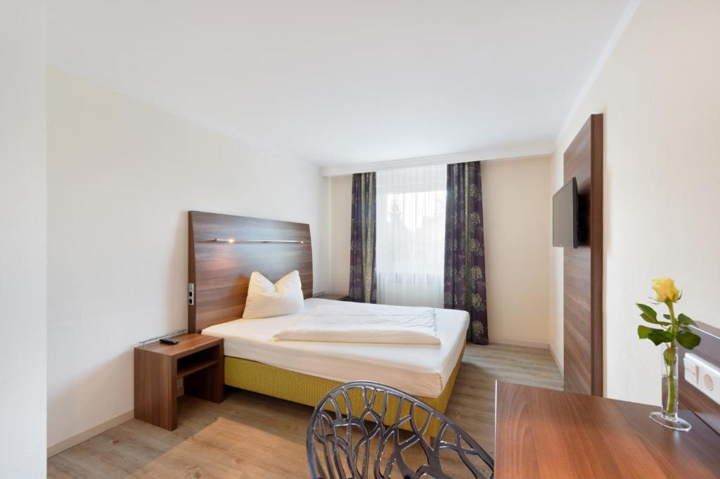 Postel nebo postele na pokoji v ubytování Hotel Säntis