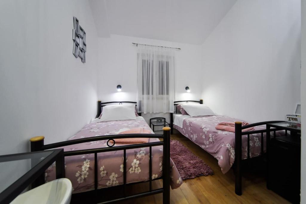 Posteľ alebo postele v izbe v ubytovaní Rooms Nekic 1