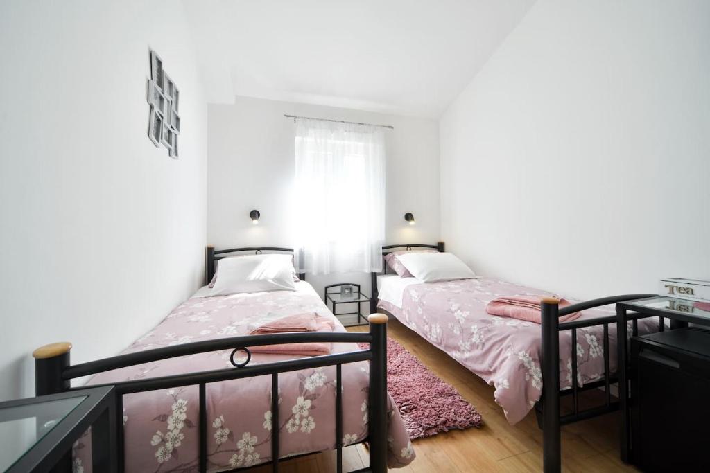 Posteľ alebo postele v izbe v ubytovaní Rooms Nekic 1