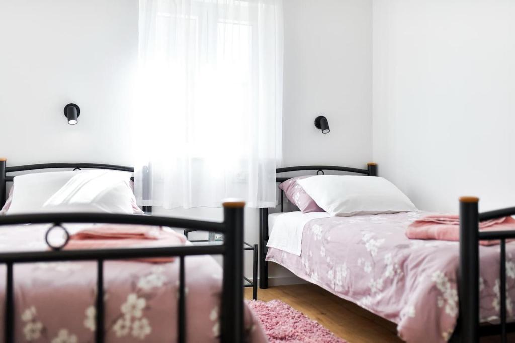 Posteľ alebo postele v izbe v ubytovaní Rooms Nekic 1