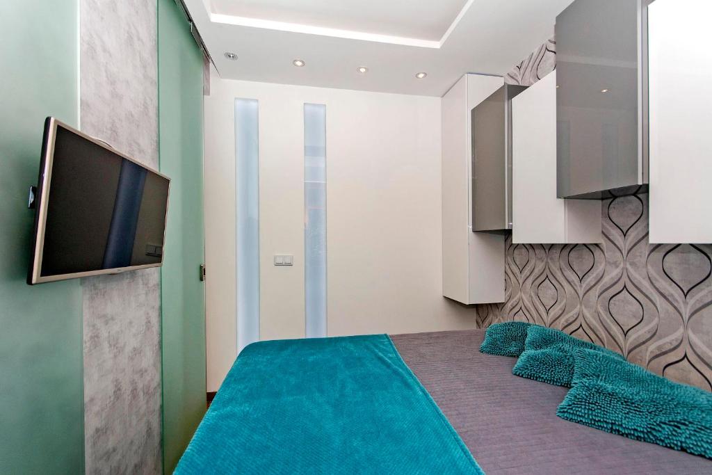 Televízia a/alebo spoločenská miestnosť v ubytovaní Przy plaży - Neptun Park by OneApartments