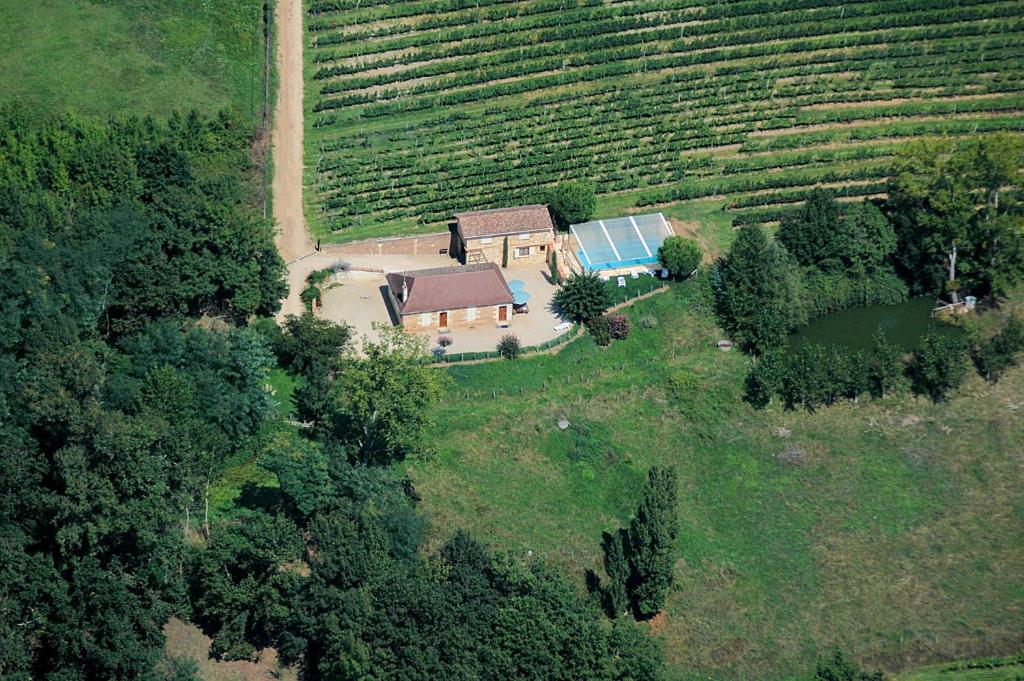an aerial view of a house in a field at Gîte du Domaine de Coutancie in Prigonrieux