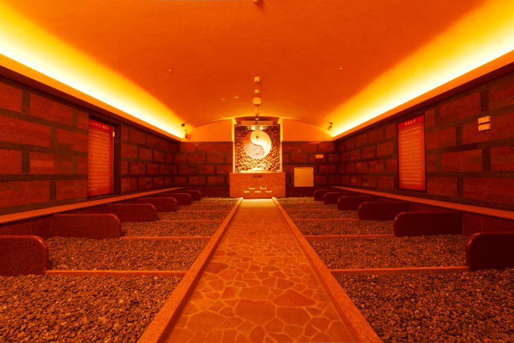 a row of chairs in a room with lights at Spa World HOTEL&RESORT in Osaka