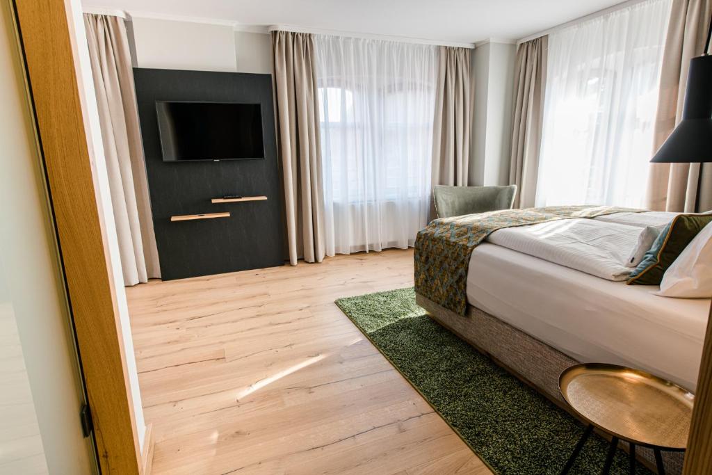 Postel nebo postele na pokoji v ubytování Weinhotel Freylich Zahn