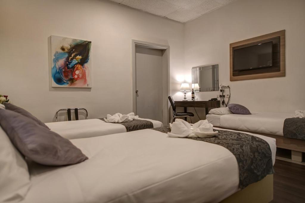 Postel nebo postele na pokoji v ubytování Europa Hotel