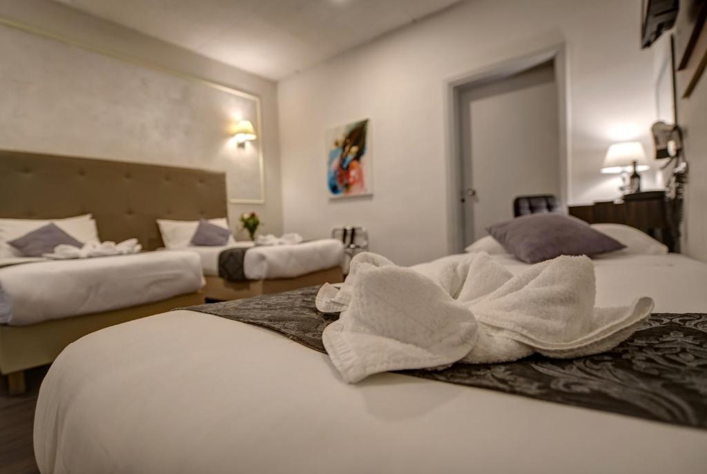 Postel nebo postele na pokoji v ubytování Europa Hotel