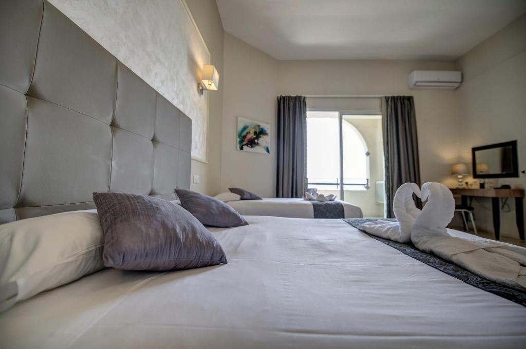 Postel nebo postele na pokoji v ubytování Europa Hotel