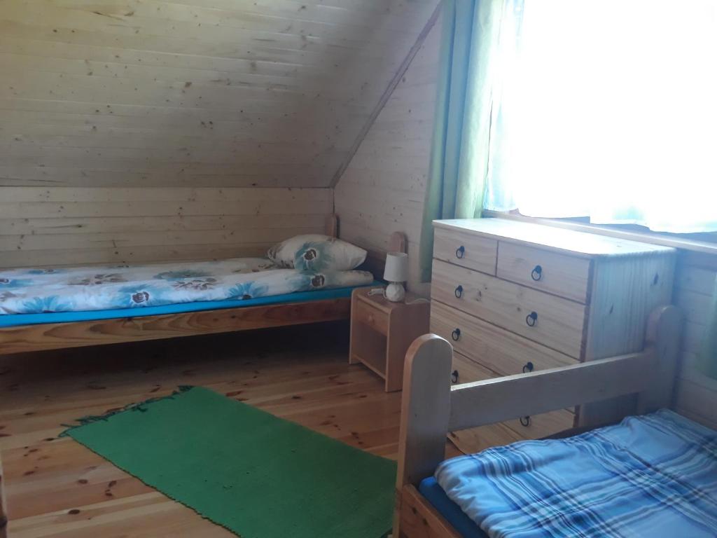 Postel nebo postele na pokoji v ubytování Pod Sokołem
