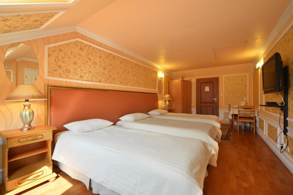 Posteľ alebo postele v izbe v ubytovaní Casablanca Pokoje i Apartamenty