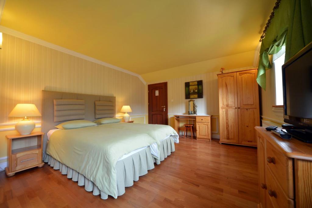 Posteľ alebo postele v izbe v ubytovaní Casablanca Pokoje i Apartamenty