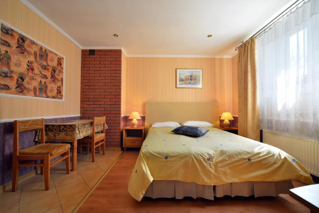 Posteľ alebo postele v izbe v ubytovaní Casablanca Pokoje i Apartamenty