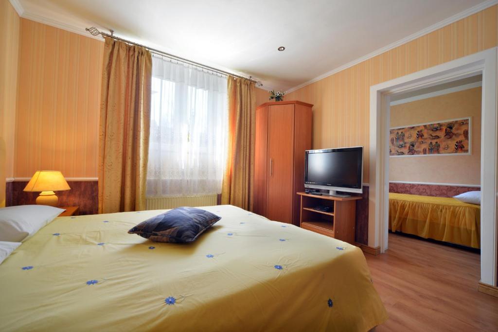 Posteľ alebo postele v izbe v ubytovaní Casablanca Pokoje i Apartamenty