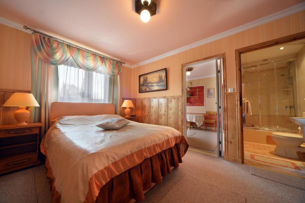 Posteľ alebo postele v izbe v ubytovaní Casablanca Pokoje i Apartamenty