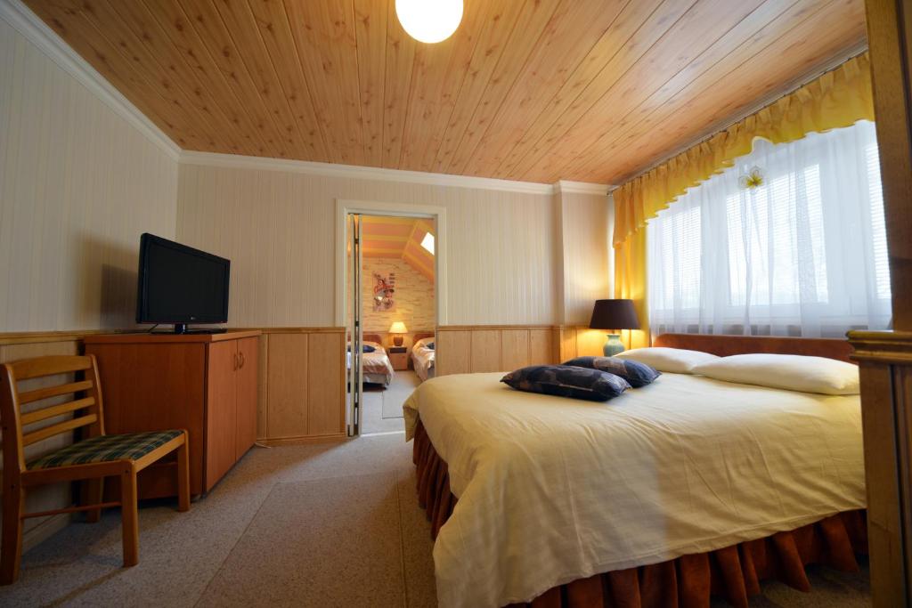Posteľ alebo postele v izbe v ubytovaní Casablanca Pokoje i Apartamenty