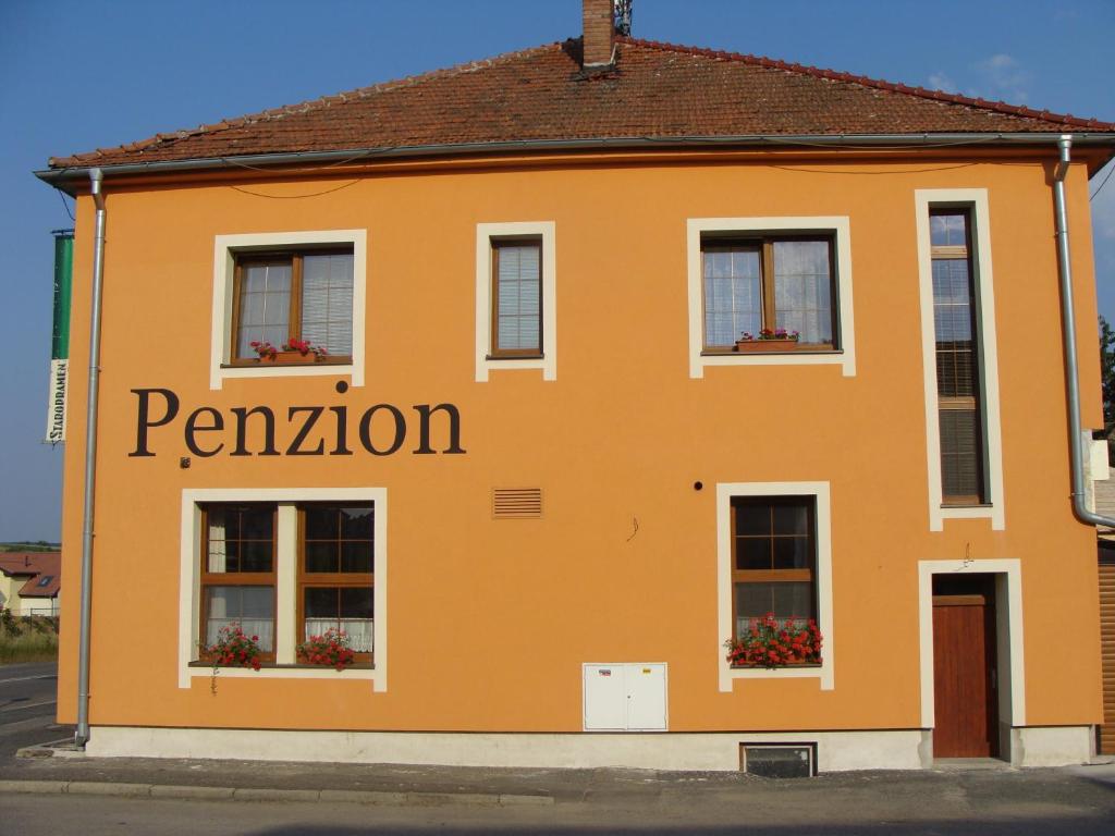 an orange building with the word pavilion on it at Penzion Vintrovna in Popůvky