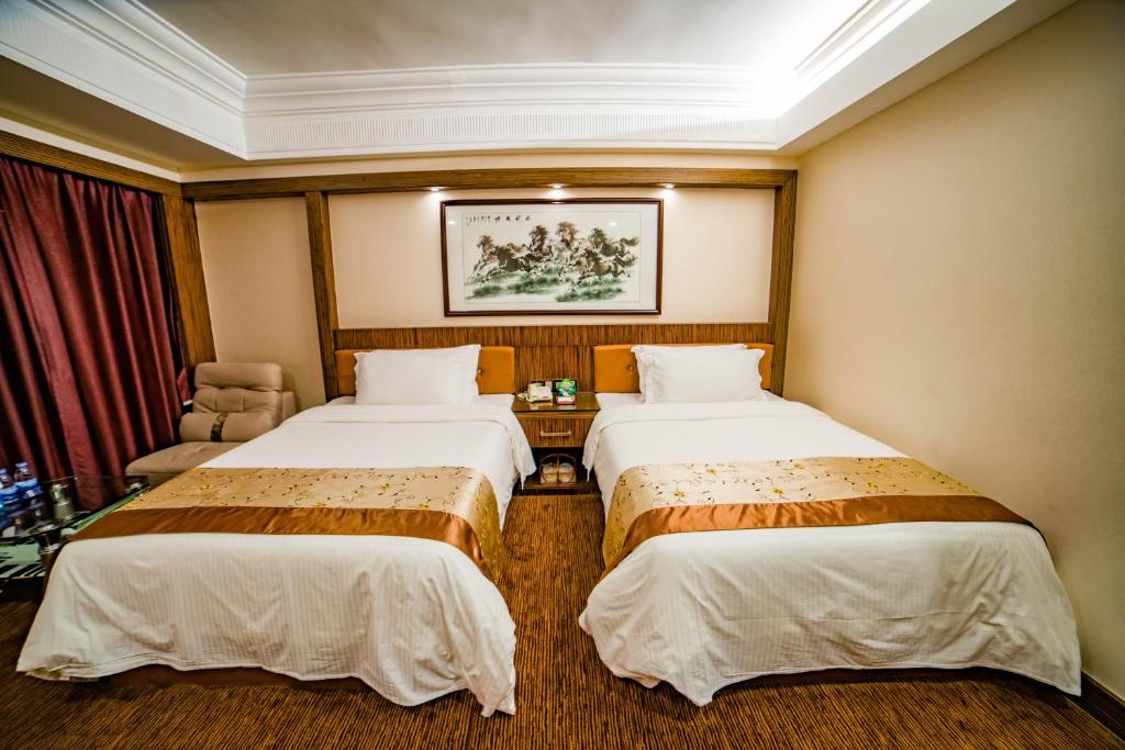 Postel nebo postele na pokoji v ubytování Nanyang King's Gate Hotel--Free Shuttle Service to Canton Fair