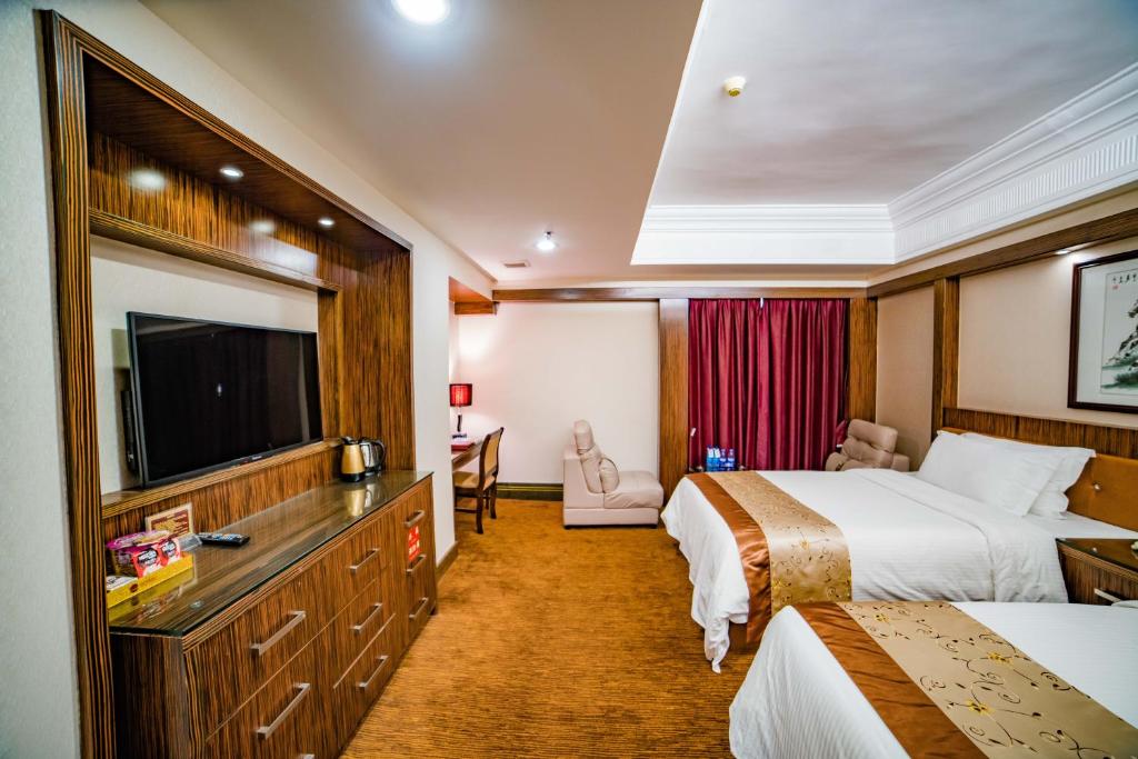 Postel nebo postele na pokoji v ubytování Nanyang King's Gate Hotel--Free Shuttle Service to Canton Fair