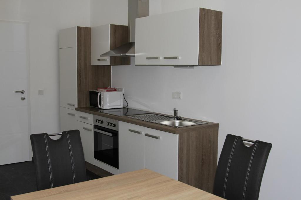 Kuchyň nebo kuchyňský kout v ubytování Apartment Fonhauser