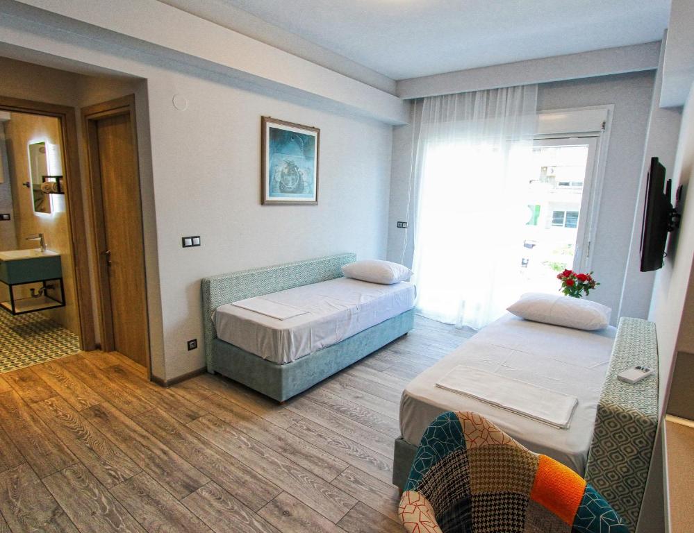 Postel nebo postele na pokoji v ubytování kon&kona kavala