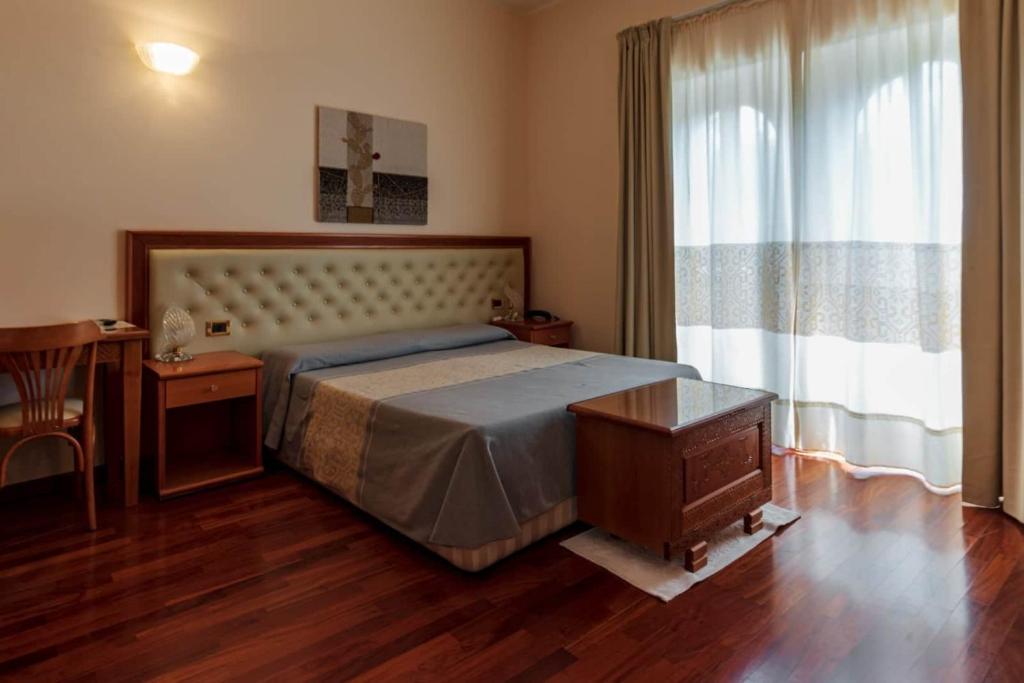 Postel nebo postele na pokoji v ubytování Hotel Del Corso