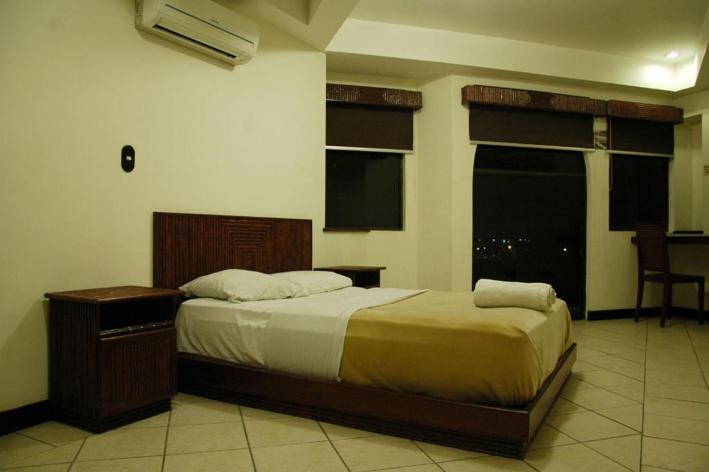 Postel nebo postele na pokoji v ubytování Alajuela Backpackers Airport Hostel