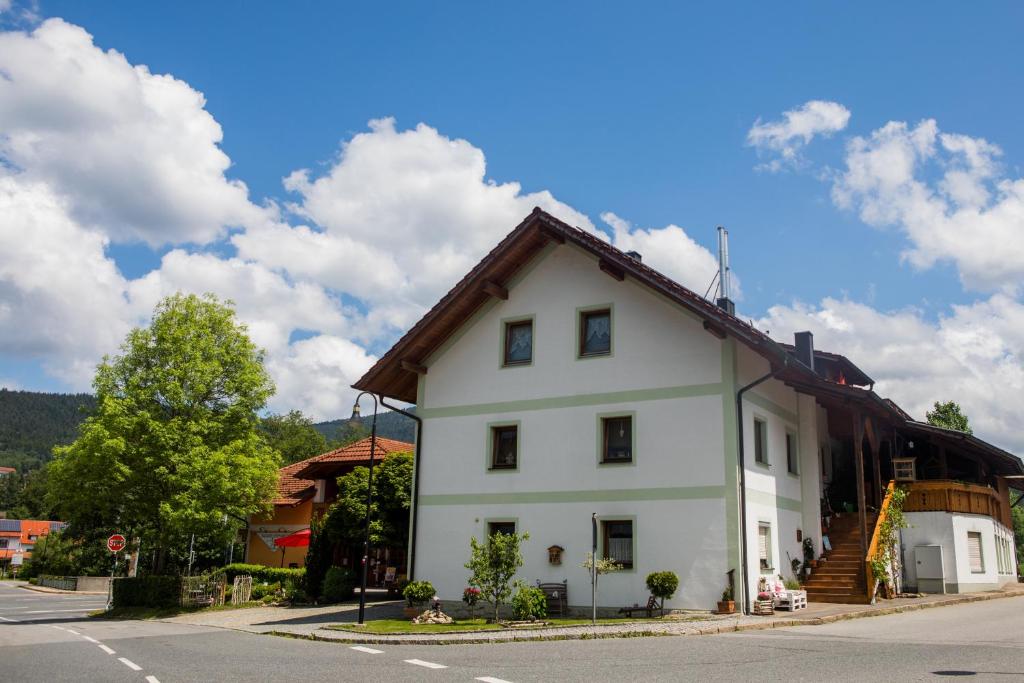 a white house with a brown roof at Sixt Martina in Lam