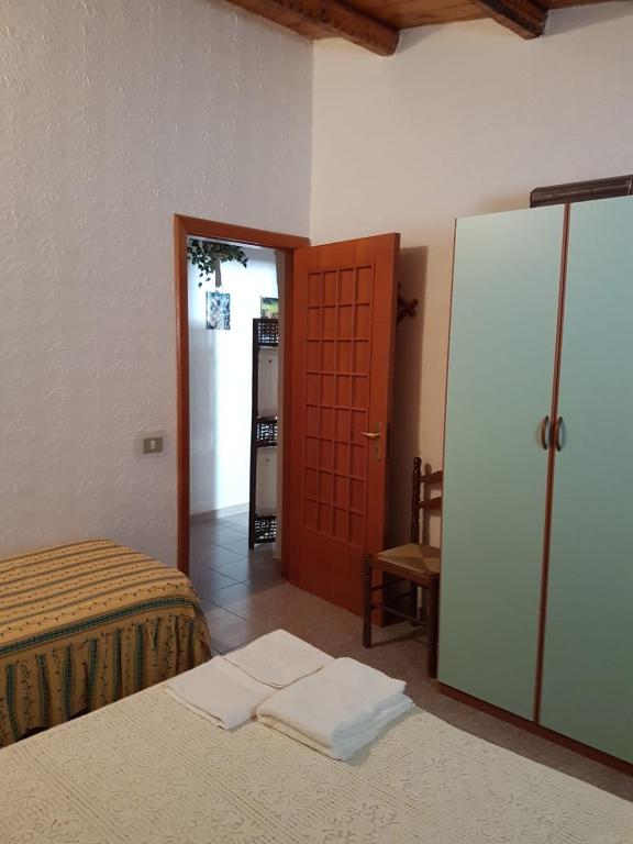 Postel nebo postele na pokoji v ubytování casa fronte mare puro relax
