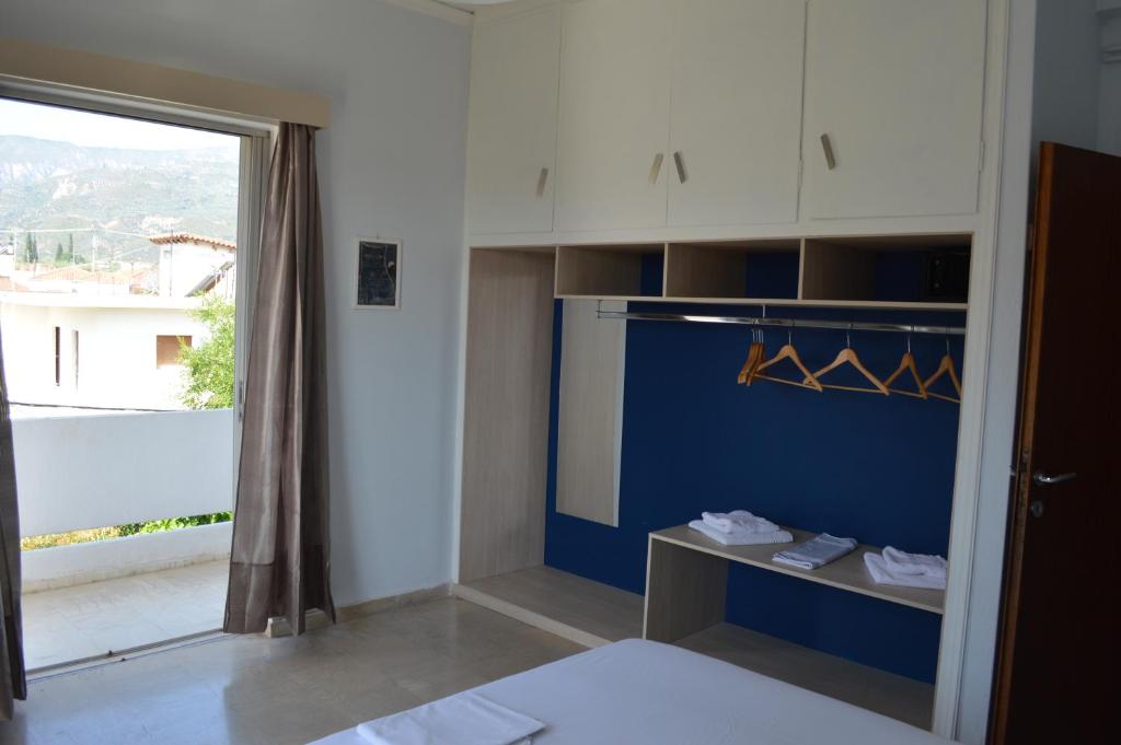 Postel nebo postele na pokoji v ubytování Dimitropoulos Apartments