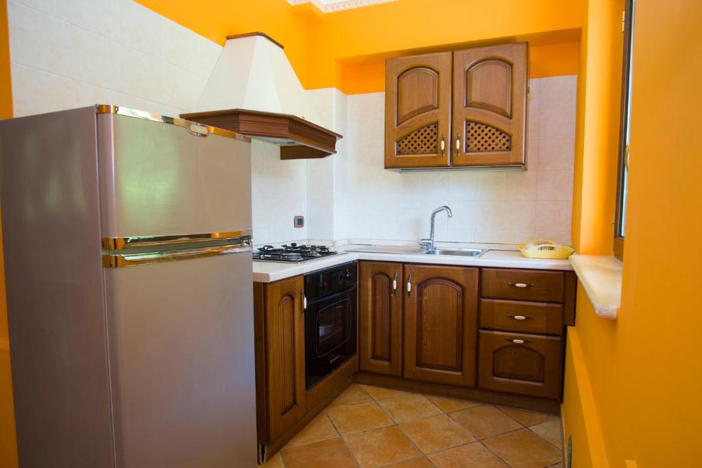 Кухня или мини-кухня в Residence Baia Infreschi
