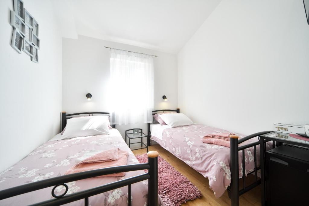Posteľ alebo postele v izbe v ubytovaní Rooms Nekic 1