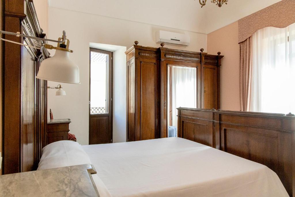 Postel nebo postele na pokoji v ubytování Dimora La Torre Room