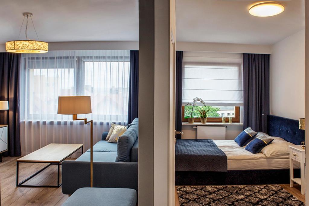 Posteľ alebo postele v izbe v ubytovaní Apartamenty Silva Hel