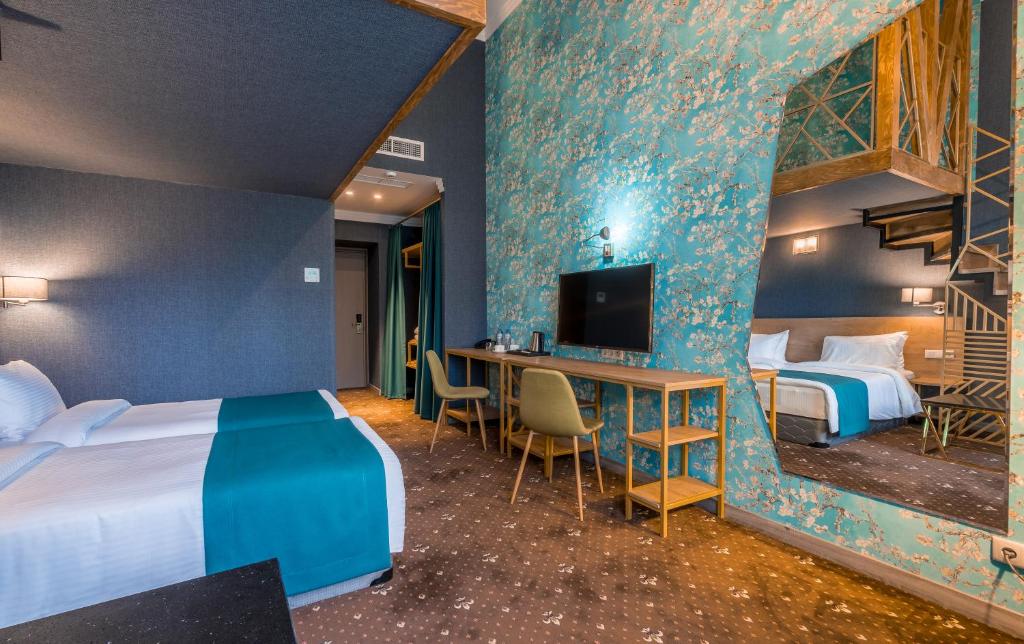 Postel nebo postele na pokoji v ubytování Gladius Inn Boutique Hotel by DNT Group