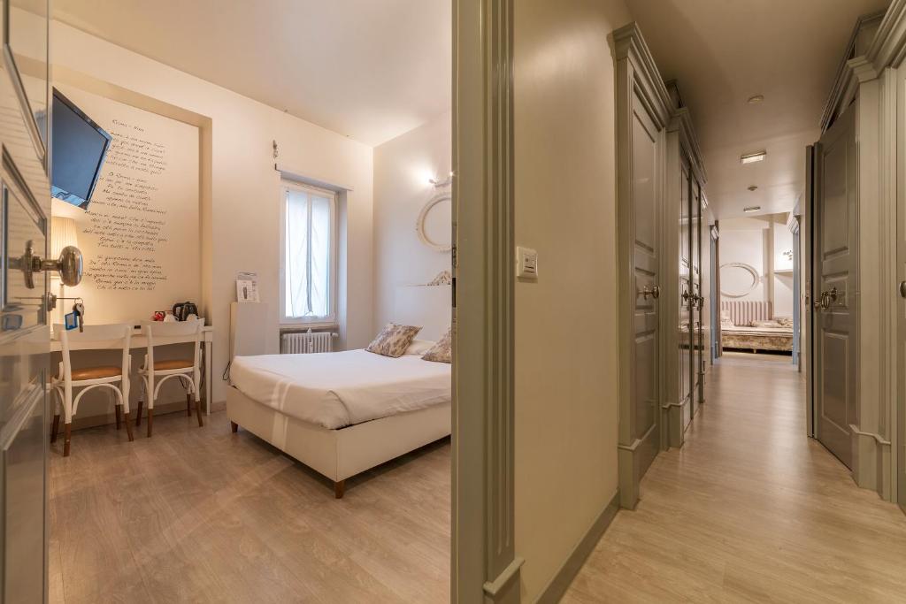 Giường trong phòng chung tại Nina Casetta De Trastevere