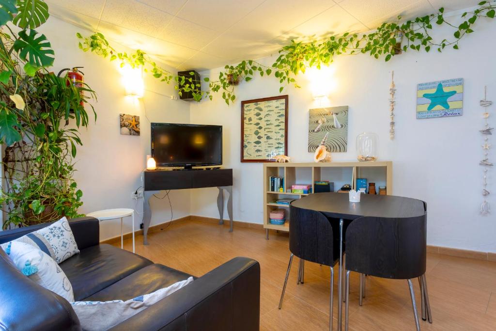 TV a/nebo společenská místnost v ubytování Hostal Manolita